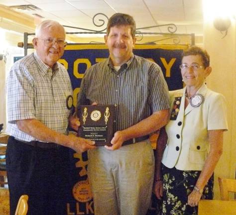 Wallkill Valley Rotary presents Community Service award to Richard A. Denman for all his contributions to the community. The Denman family runs the well-known &quot;Pleasant Acres Campground&quot; in Wantage Township which was started in 1972. Presenting the award to Richard A. Denman is Wallkill Valley Rotarian Fred Kattermann with President Sharon Hosking.