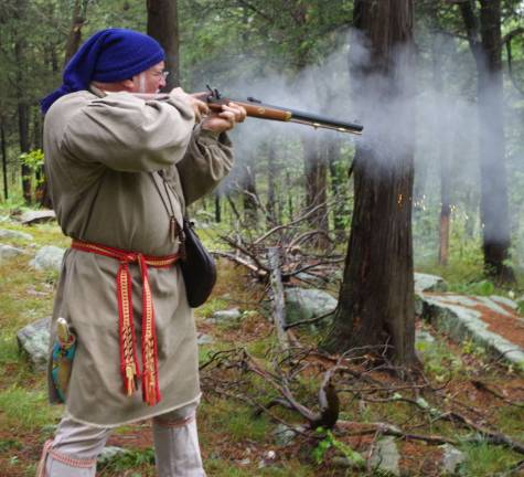 Armed with a musket, re-enactor &#xfe;&#xc4;&#xfa;Buffalo Man&#xfe;&#xc4;&#xf9; Frank Diraimondo of Oakland spent much of Saturday afternoon in the woods at High Breeze Farm on Vernon&#xfe;&#xc4;&#xf4;s Wawayanda Mountain. Sparks can be seen in the air below the musket&#xfe;&#xc4;&#xf4;s muzzle.