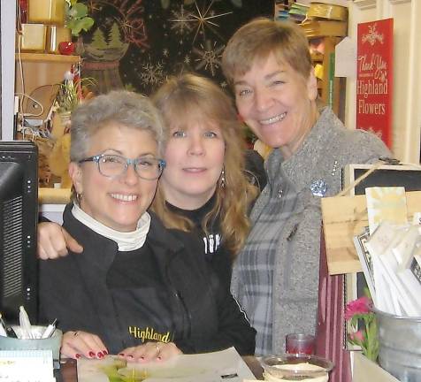 From left, Rita-Ann Schmick, Jamie Meyer and Lauren Daly work hard at Highland Flowers perfecting customer satisfaction.
