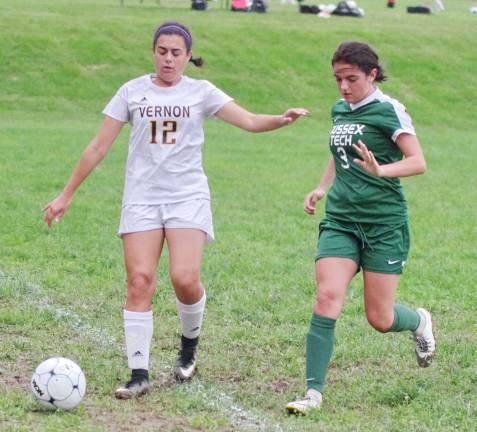 Vernon's Eleni Polizos and Sussex Tech's Sabrina Cusumano pursue the ball.