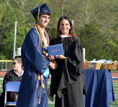 Vernon Township High School Class of 2024 Principal Lindsay Leduc-Young hands a diploma to Michael Evanick. (Photo by Theresa Sabia)
