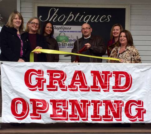 Vernon Township Mayor Harry Shortway, center, cuts the ribbon to celebrate the grand opening of Shoptiques, located at 564 County Highway 515 in Vernon. Also shown is Councilwoman Jean Murphy, Director of Community Affairs Missi Wiedbrauk, Shortway and store owner Jennifer Ruffo are shown. The store features weomen's and men's clothing, along with jewelry, coins, shoes and handbags.