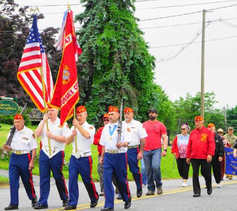 PHOTOS BY VERA OLINSKIPFC J. Patterson, Marine Corps League Color Guard #747 marches.