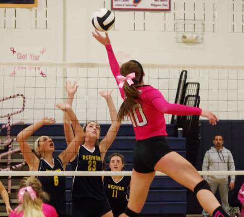 Jefferson wins Dig Pink volleyball match Jefferson's Julia Murawinski (10) reaches for the ball.