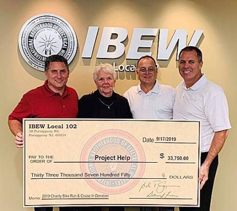 IBEW Local 102 Treasurer Dave Fiore, Project Help Executive Director Sandy Mitchell, IBEW Local 102 Business Representative Mike Scotto, and IBEW Local 102 President Bernie Corrigan.