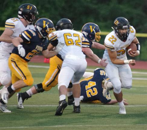 West Milford quarterback Zackary Milko carries the ball through an opening in the Vernon defense.