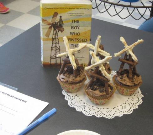 First-place youth winner Elizabeth Lazzano&#x2019;s cupcakes represented The Boy Who Harnessed the Wind. Windmills were creatively made from pretzels.