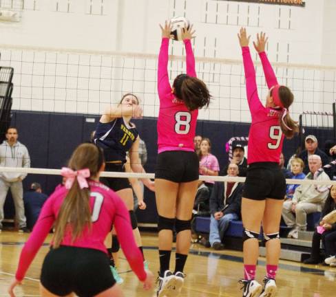 Jefferson wins Dig Pink volleyball match Jefferson's Gabby Rozjabek (8) and Katie DeBell (9) attempt to block the ball struck by Vernon's Julia Dehnert (11).