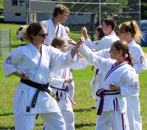 Vernon Valley Karate instructors and students practice combat moves.