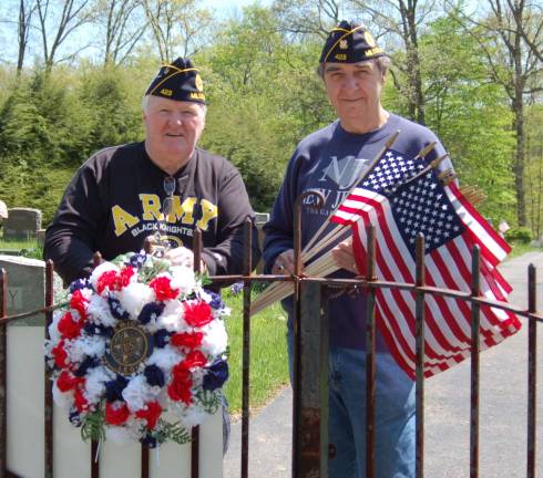 American Legion Post 423 members Michael Murphy and David Wilton get ready to decorate the graves of Veterans in the Milton Cemetery for Memorial Day.