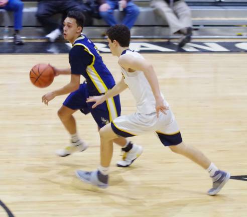 Vernon's Jacob Rodriguez dribbles the ball while covered by Delaware Valley's Joe Cansfield.