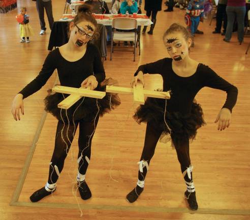 &quot;The Broken Marionettes&quot;' Gabby Defeo, left, and Morgan Mulvaney, right, both 12, won the prize for &quot;The Most Original&quot; costume in the Barry Lakes Halloween Parade.