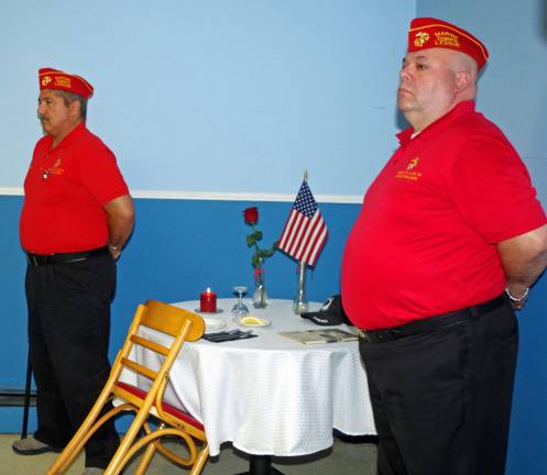 Standing beside the table during the &quot;empty table&quot; ceremony were Richard Periu of Hardyston (left) and David Vnenchak of Stanhope. They represented the Sussex County P.F.C. Jeffery S. Patterson Marine Corps Detachment 747.