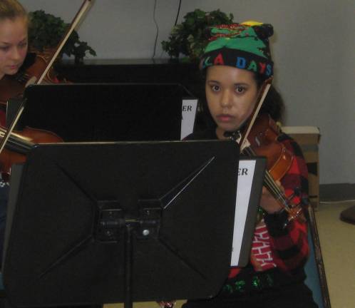 Chamber Orchestra concert celebrates Christmas Violinist Nicole is holiday ready and concentrating deeply at the Dec. 20 concert.