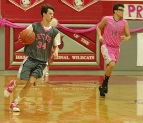 High Point boys win pretty in pink showcase High Point's Landis French handles the ball. French scored 15 points.