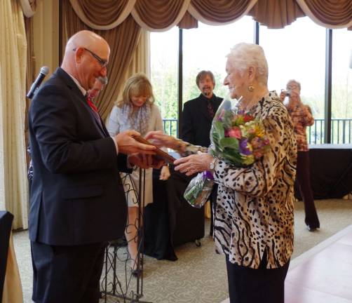Vernon Township Mayor Harry Shortway is shown presenting Pat Reilly with a plaque recognizing her as Vernon&#xfe;&#xc4;&#xf4;s Outstanding Senior of the Year.