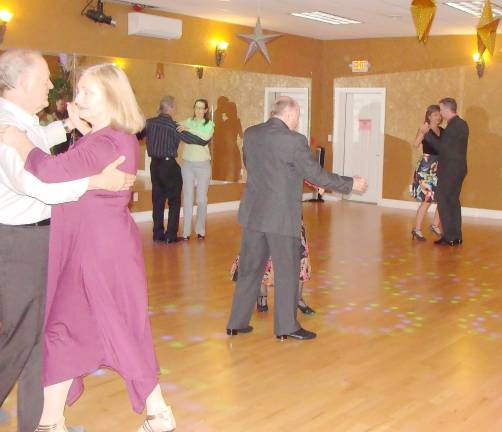 The dance floor is jumping as the Friday night dance social at the Frank Duval Ballroom react to the music