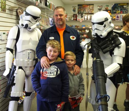 Standing with the stormtroopers is Hamburg resident John Jervis along with his sons Jason, 8, and Mathew, 5. The event was Free Comic Book Day at Bob&#xfe;&#xc4;&#xf4;s Collectables in Hardyston.