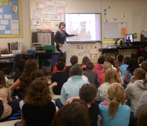 Fourth graders learn about Ruby Bridges Fourth-grade students with CMPS teacher, Sandra Friedhoff.