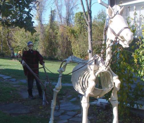 Halloween couldn't be better than a display at the Burgess-Ford home on Route 515. A skeleton farmer and a skeleton horse plow the lower 40. Last year, the Headless Horseman was on display. Marlene Burgess-Ford promises something even better for next year.