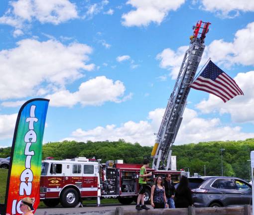 PHOTOS BY GEORGE LEROY HUNTER Old Glory flys high in the sky courtesy of the Sussex Fire Department.