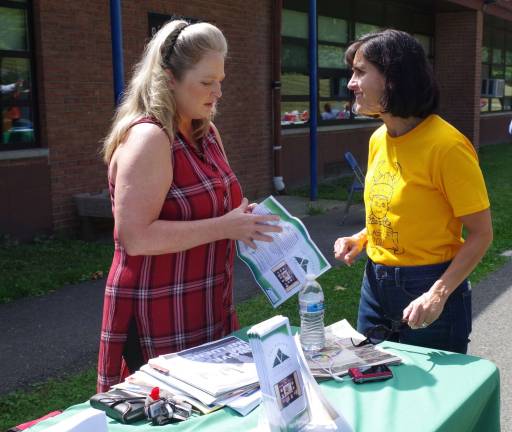 At left, Hardyston resident Rebecca Dorney of The Vernon Coalition To Be Drug Free is shown sharing literature with Walnut Ridge Primary School Principal Rosemary Gebhardt.