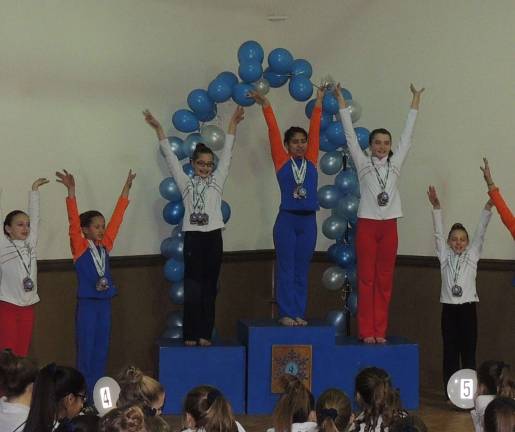 Giant Gymanstics’ Garden Gators take top honors The first-place AA winners Emily Rodriguez of Stillwater is shown. Caroline Dietz of Lafayette finished fourth.