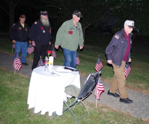 Veterans approach the memorial.