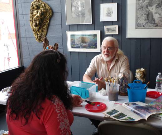 West Milford artist Oscar Beck introduced visitors to watercolor painting. Along with a life-size outdoor sculpture, he also brought with him a sculpture of an elf-like character.