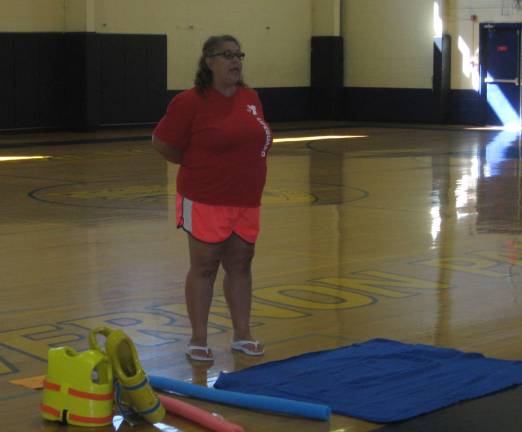 Upcoming kindergartners visit Safety Town Ms. Sarah of the YMCA explains water safety and precautions to the Safety Town youngsters at the Tuesday Aug. 1 program.