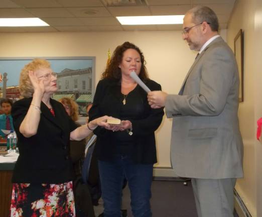 Sussex Borough Councilwoman Katherine Little was sworn in by Borough Clerk Mark Zschack and while her daughter, Wendy Kovach, holds the bible.