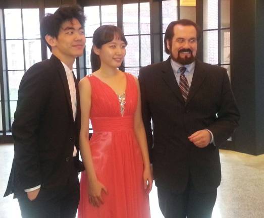 Dueling Pianists performers Ko-Eun Yi and Daniel Hsu with Maestro Maull