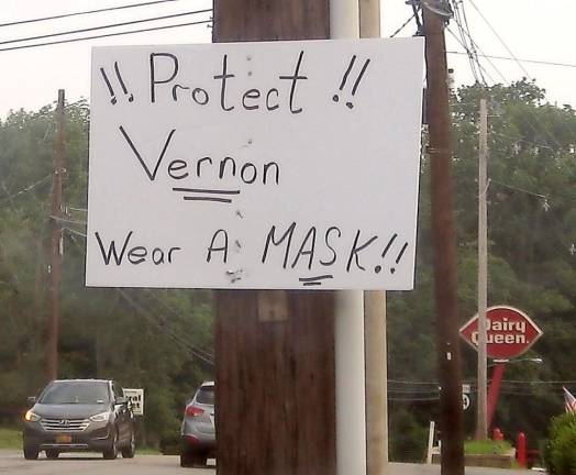 Protect Vernon A concerned resident placed a sign on Route 94 in Vernon, stressing the importance of a protective mask.