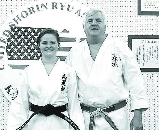 Vernon teen attains karate black belt Christina Pappan, who earned her black belt is pictured with Sensei Tom Shull.