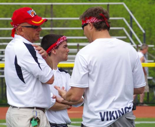 At left, Vernon Lacrosse coach Harry Shortway is shown conferring with two other Vernon coaches during the Vikings&#xfe;&#xc4;&#xf4; game over High Point Regional High School.