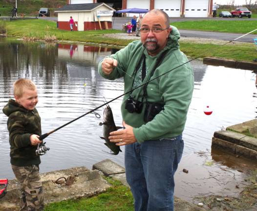 Jax Meyer, 5, of Glenwood kept his dad, Dale, busy catching one large catfish after another at the annual Vernon PAL Fishing Derby on Saturday.