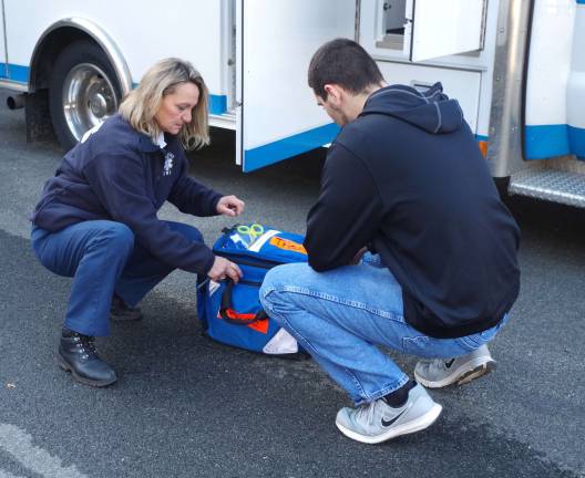 Wantage Township First Aid Squad member Cathy Toth shows an ambulance&#xfe;&#xc4;&#xf4;s equipment and features to a perspective first aid squad member.