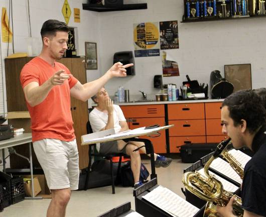 Photo by Justina AddiceDirector Matt Gramata prepares the students for their concert.