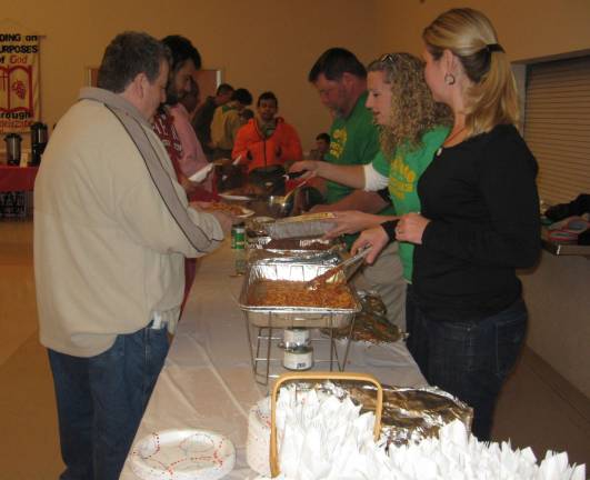 Scout moms and dads dish up the tasty helpings. Being Veterans Day, vets ate for free.