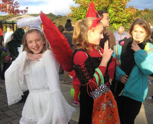 Kylie and Sadie are devil and angel at the Highland Lakes trunk or Treat on Oct. 28.