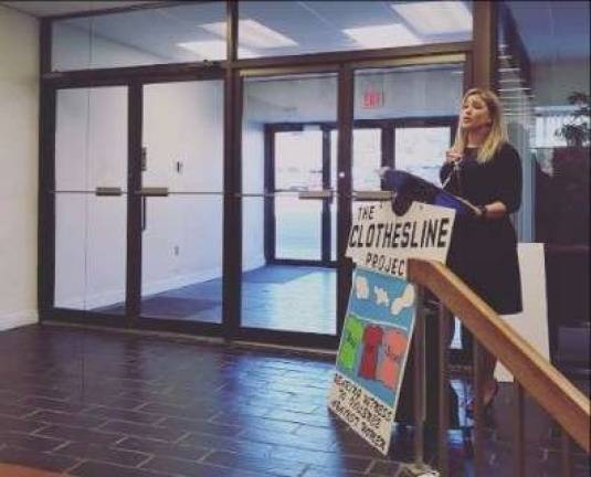 Kellyan Kostyal-Larrier speaks at the opening ceremony and press conference for &quot;The Clothesline Project&quot; on Oct. 2 (Photo provided)