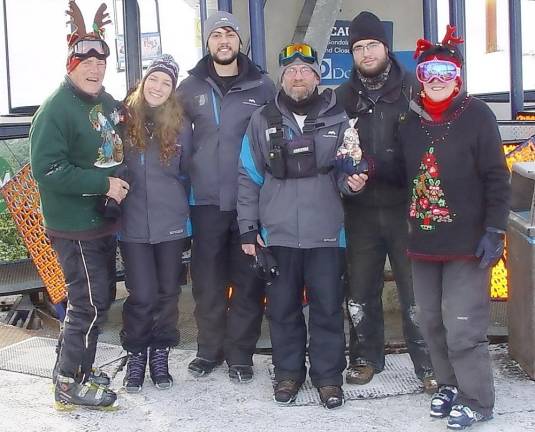 John (left) and Buffy Whiting (right) say “Thanks” to Lift Operations Supervisor Brian, John Friend, and lift operations staffers with Christmas cookies.