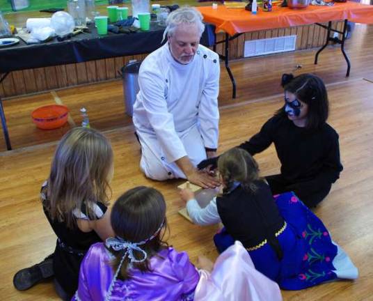 With Scott Smolder guiding these sorcerer apprentices, everyone got a chance to be a mad scientist. Smolder provided the children with excerpts from his program &quot;Adventures in Science.&quot; He is also a science teacher at Pompton Plains High School.