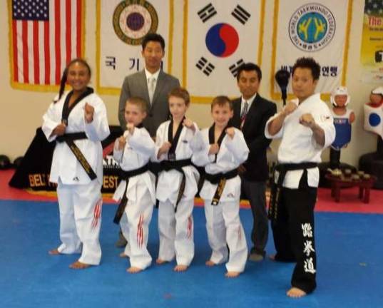Four of Master Ken's students became Black Belts. They all passed eight weeks of special training, egg tradition for 10 days and fasting for 3 days. Master Ken's Black Belt students receive a certificate from Taekwondo Headquarters in Korea. Pictured from left are: Cassidy C., Nathaniel C.(Wantage), Brian L. (Hamburg) &amp; Alexander G. (Wantage).