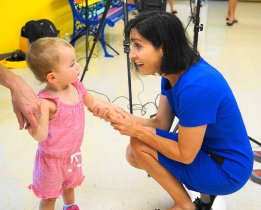 PHOTOS BY VERA OLINSKIPrincipal Rosemary Gebhardt, on right, greets a future student.