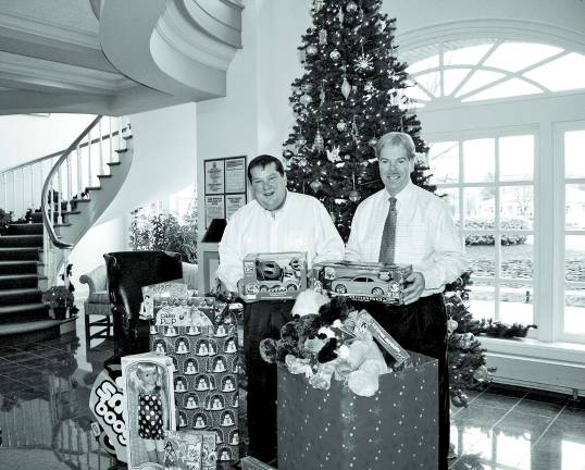 Lakeland Bank workers, customers participate in gift program Lakeland Bank President and Chief Executive Officer Tom Shara presents gifts to Peter Thornton, executive director of the Boys and Girls Club of Paterson and Passaic. The gifts were collected by Lakeland Bank colleagues and customers as part of the Bank’s Annual Share-A-Gift program.