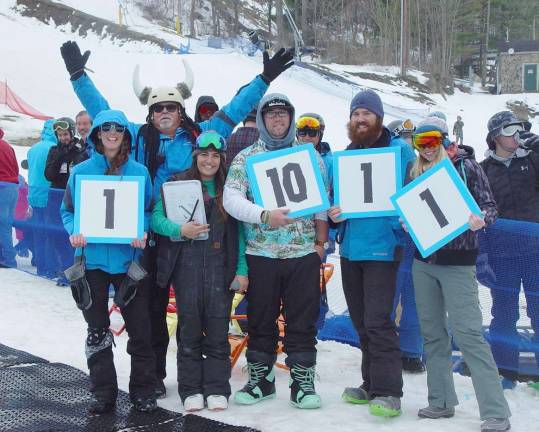 Mountain Creek Staffers score the participants in the Pond Skimming competition