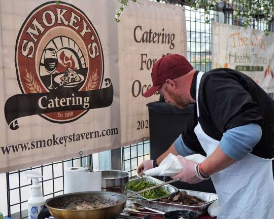 One of Smokey's Chefs adds the finishing touches.
