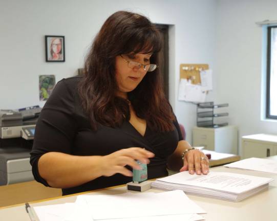 Vernon Township Clerk Lauren Kirkman individually inspected and then hand-stamped the over 400 petitions submitted by current councilman Dan Kadish and resident Sandy Ooms.