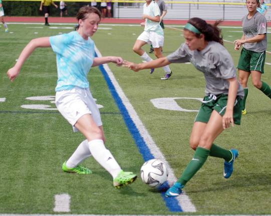A Vernon Viking and a Minisink Valley Warrior move toward the ball. Vernon Township High School (Glenwood, N.J.) hosted Minisink Valley High School (Slate Hill, N.Y.) for a girls soccer scrimmage on Monday, August 31st 2015. The Vernon Vikings and Minisink Valley Warriors are preparing for the upcoming season.